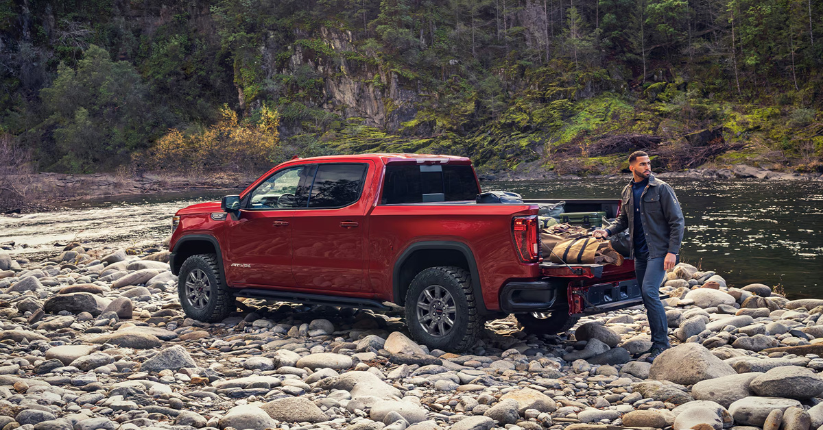 2026 GMC Sierra 1500 – Parked by a rocky riverbed